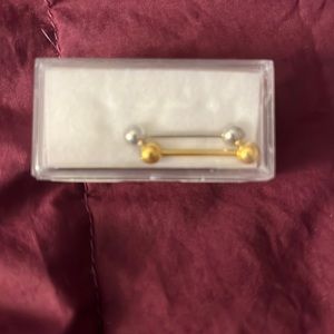 Belly piercing jewelry one gold and one silver. Brand new.